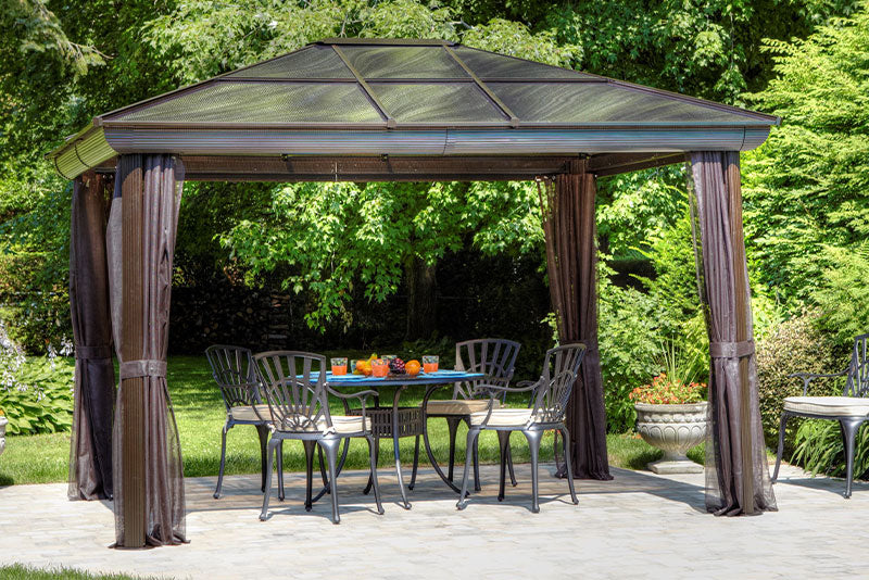 Gazebo Penguin Venus Gazebo Polycarbonate Roof - 10'x10' front view curtains open with table and chairs outdoors brown colour